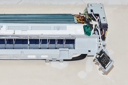 Inverter Air conditioning service, repair and maintenance concept. The specialist cleans and repairs...