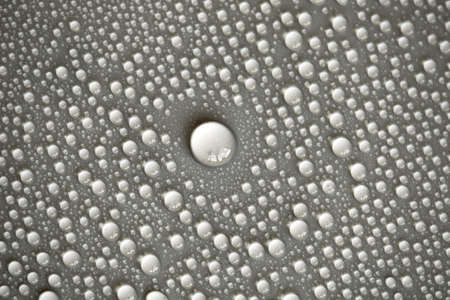 Large number of water drops. Abstract background texture. Waterfalls on a solid background, collecting bubbles on a clean surface. Raindrops, a series of natural photographsの写真素材