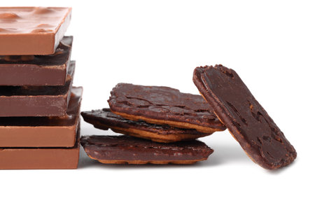 Chocolate bars with nuts and chocolate chip cookies closeup on white isolated background with cutoutの写真素材