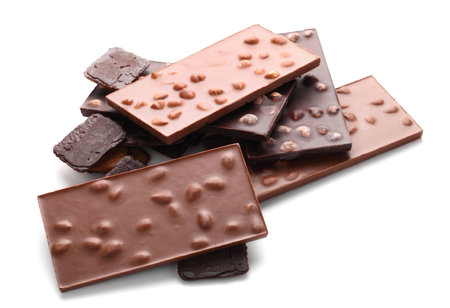 Chocolate bars with almonds and nuts close up on white isolated backgroundの写真素材