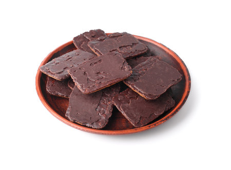 Chocolate chip cookie on a saucer on white isolated backgroundの写真素材