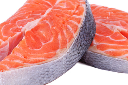 Salmon steak, fresh fish slice, trout on white isolated background with clipping path, full depth of fieldの写真素材