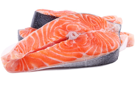 Fish salmon large piece of steak, large piece of red sea fish close-up on white isolated backgroundの写真素材