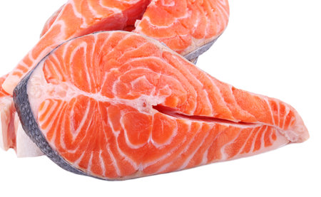 Fish salmon large piece of steak, large piece of red sea fish close-up on white isolated backgroundの写真素材