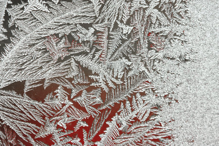 Background of natural frozen glass, window glass with a beautiful pattern