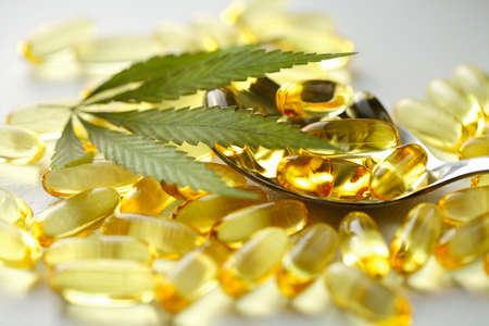 Cannabis Hemp Oil or CBD Oil Capsules, Food Organic Food Supplements. Alternative medicine concept. Cosmetics and skin care productsの写真素材