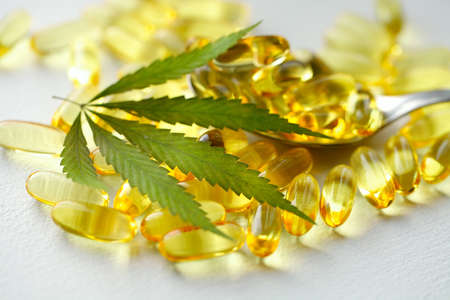 Cannabis Hemp Oil or CBD Oil Capsules, Food Organic Food Supplements. Alternative medicine concept. Cosmetics and skin care productsの写真素材