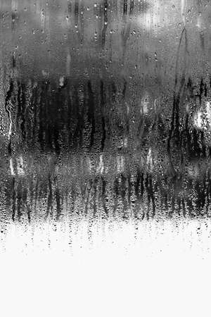 Vertical background of condensation on transparent glass with high humidityの写真素材