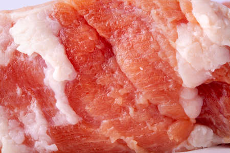 Raw beef, sliced piece for cooking, close-up. Piece of fresh red meatの写真素材