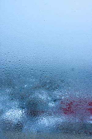 Condensation on the clear glass window. water drops. Rain. abstract background texture. Outside the window, bad weather, rainの写真素材