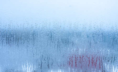 Condensation on the clear glass window. water drops. Rain. abstract background texture. Outside the window, bad weather, rainの写真素材