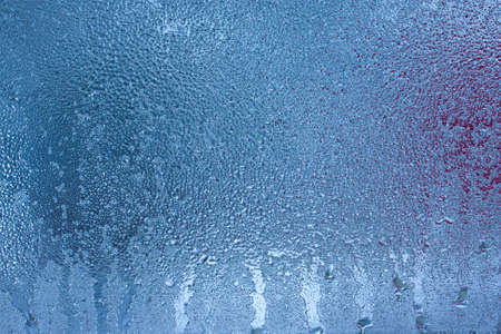 Condensation on the clear glass window. water drops. Rain. abstract background texture. Outside the window, bad weather, rainの写真素材