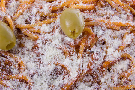 spaghetti with parmesan and olives looking very tastyの写真素材