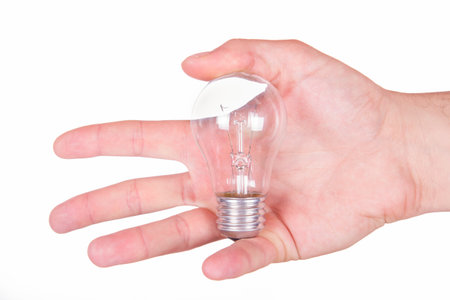 hand showing light bulb isolated on white background