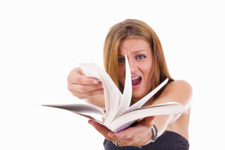 angry female student flipping a book, studio  isolated on white backgroundの写真素材