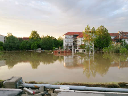 flooded city with view of road, flood and disaster in town Obrenovac in Serbia, damaged houses and property, state or condition after terrible flood, destroyed and abandoned cityの写真素材