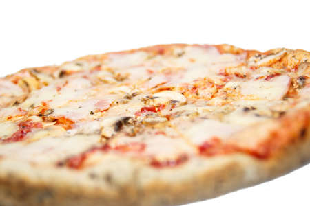 Tasty delicious pizza capriciosa with cheese ham and mushrooms, focus on the middleの写真素材