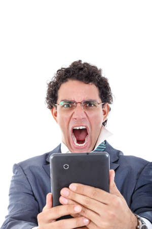 upset, pissed off and tired man in suit uses tablet for work or for private purpose. の写真素材