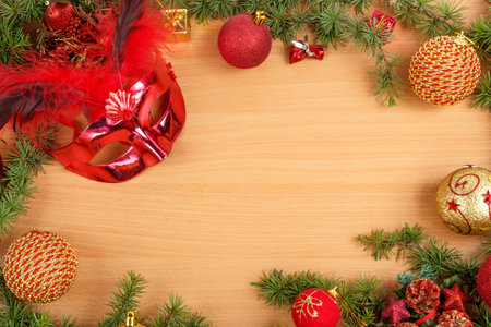 Christmas decoration with fir tree , glamor mask masquerade for party and celebration and ornamentals gifts on wood table with copyspace , blank space place for text and advertising, family or business greeting card for New Year's holidaysの写真素材