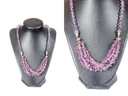 Beautiful stylish handmade handcrafted woman bijouterie or female vintage fashion antique colorful jewelry necklace on black model showpiece doll isolated on white background. Close up studio shootの写真素材