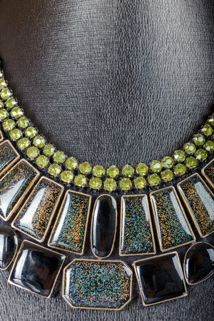 Beautiful stylish handmade handcrafted woman bijouterie or female vintage fashion antique glamor colorful jewelry necklace on mannequin model showpiece doll isolated on white background. Studio shootの写真素材