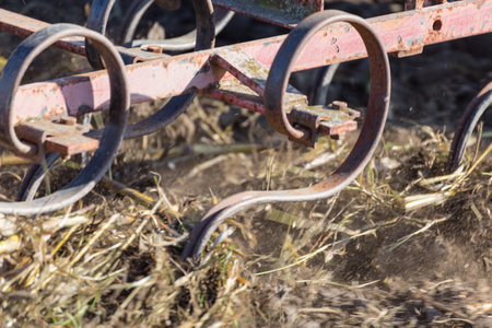 Close Up Detail of an Agricultural Plough in Action Plowing an Overwintered Field in Preparation for...