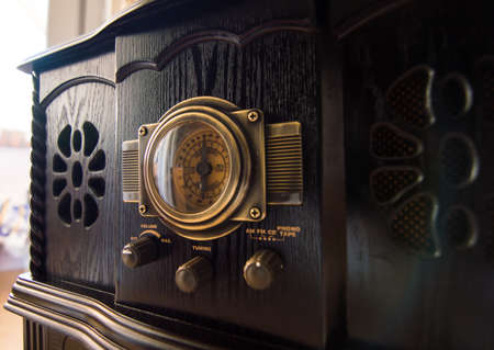 old dark tone wooden record player with vinyl recordの写真素材