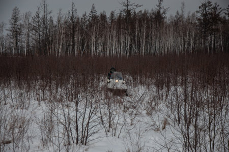 Traveling and outdoor activities in winter on snowmobiles.