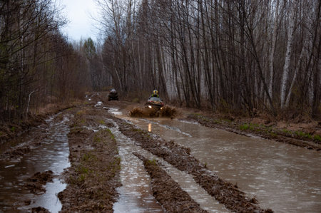 A quad bike in difficult conditions while traveling.