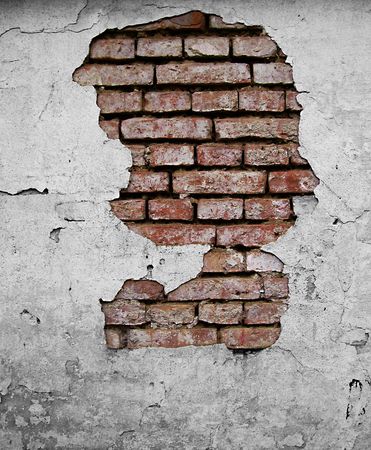 bricks seen through broken plasterの写真素材