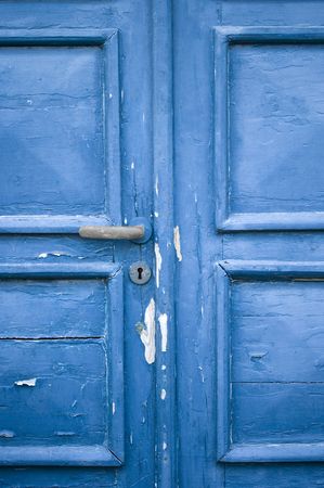  blue door with cracked and peeling paintの写真素材