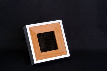 Square picture frame out of wood and metalの写真素材
