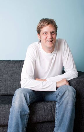 portrait of a casual man sitting downの写真素材