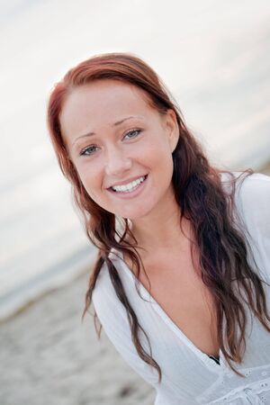 portrait of a beautiful young woman with big smileの写真素材