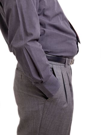 Man with bulging belly and hand in his pocketsの写真素材