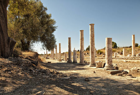 On of the colonaded streets from ancient times amongst the ruins of ancient Side, Turkey の写真素材