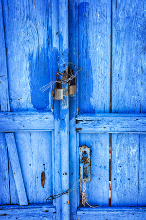 Image of bright blue door on Santorini, Greece. の写真素材