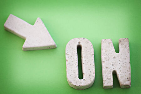Image showing an arrow pointing at an ON sign.の写真素材
