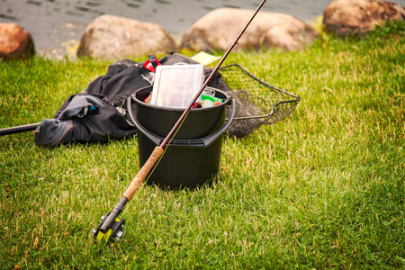 Image of fishing gear on the grassy shore.