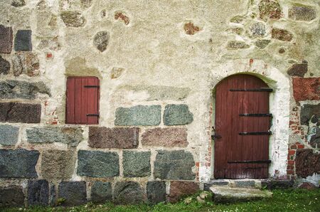 Image of an old door in a stone building. Borgeby castle, Sweden.のeditorial素材