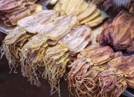 Image of dried squid at fish market in Thailand.の写真素材