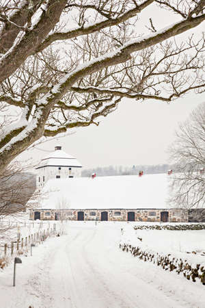 Image of Hovdala castle with its gatehouse and barns. Hassleholm, Sweden.のeditorial素材