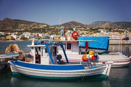 Image of small fishing boats in the village port. Makrigialos, Crete.の写真素材