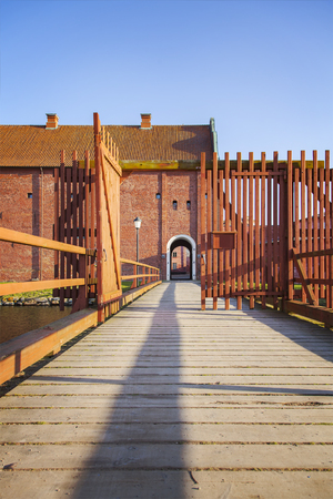 Image of the a wooden foot bridge leading to the citadel in Landskrona, Sweden.のeditorial素材