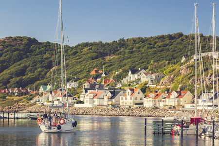 MOLLE, SWEDEN - AUGUST 2, 2016: Sailboat in the harbour of the seaside village of Molle, Sweden.のeditorial素材