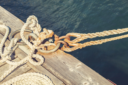 Image of old boat rope tied to the pier.の写真素材