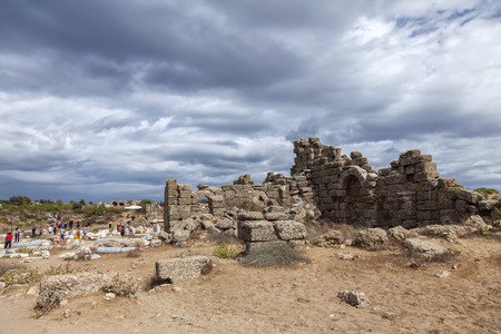 SIDE, TURKEY - OCTOBER 03, 2013: Tourists visiting the ancient ruins in of the state agora.のeditorial素材