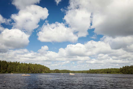 Cloudy summers day at lake in Smaland, Sweden.の写真素材