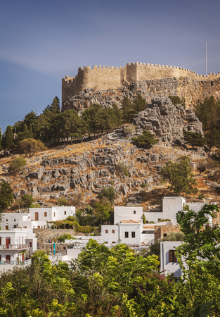Village of Lindos with fortress on hilltop. Rhodes, Greece.のeditorial素材