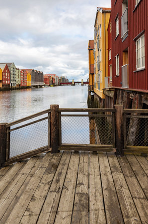 Colourful buildings along the river nidelva, in Trondheim, Norway.